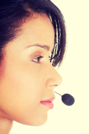 Beautiful young call-center assistant smiling , isolatedの写真素材