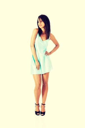 Pretty woman in night underwear, isolated on white.の写真素材