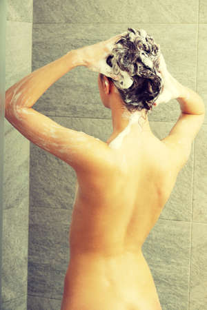 Beautiful  fit woman taking showerの写真素材