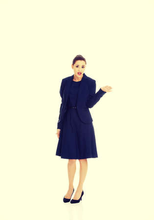 Anoyed and displeased businesswoman standingの写真素材