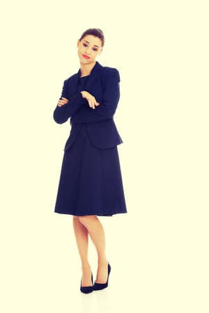 Anoyed and displeased businesswoman standingの写真素材