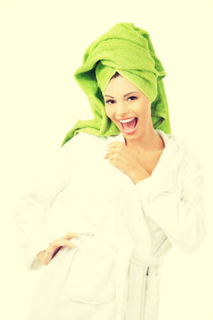 Beautiful spa woman in bathrobe and turban.の写真素材