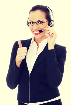 Smiling call center woman with headsetの写真素材