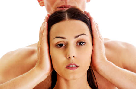Man covering women's ears, isolatedの写真素材
