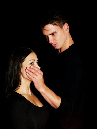 Man covering women's mouth, isolatedの写真素材