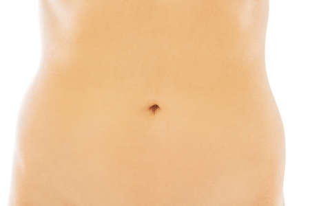 Slim beautiful nude woman's belly.の写真素材