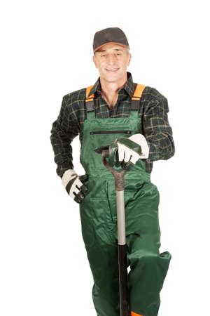 Smiling experienced gardener with a spadeの写真素材