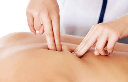 Woman having massage of body in the spa salon. Beauty treatment concept. Isolated.の写真素材