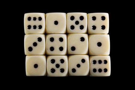 White dice isolated on black background.