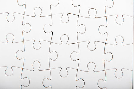 Jigsaw puzzle with blank white pieces.