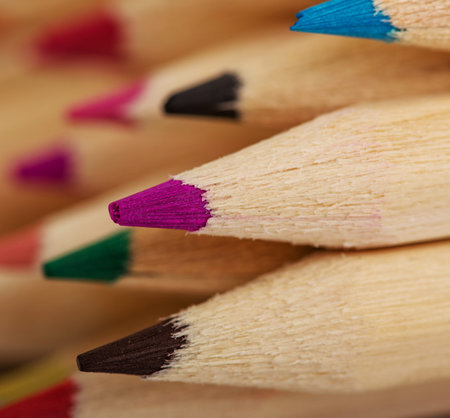 Colored pencil crayons isolated on a white background.