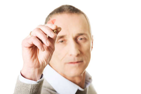 Mature man aiming by dart.の写真素材