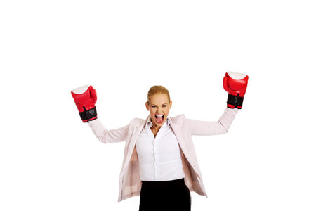 Business woman in red boxing gloves.