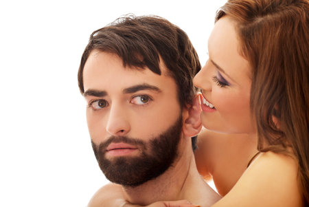 Beautiful passionate shirtless couple embracing.の写真素材