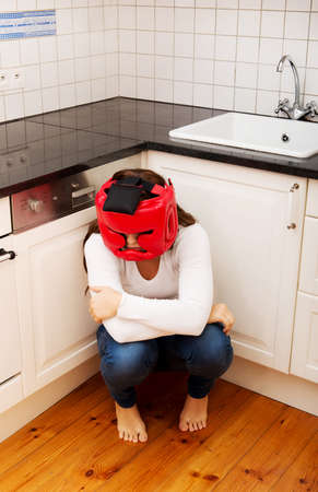 Young woman in fear of domestic abuse.の写真素材