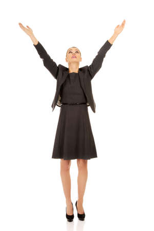 Young happy business woman with arms up.の写真素材