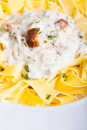 Pasta with cream sauce with chanterelle.の写真素材