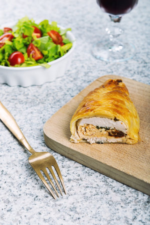 Chicken breast in french pastry with fresh salad.