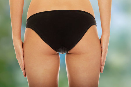 Sexy woman's back in underwear.