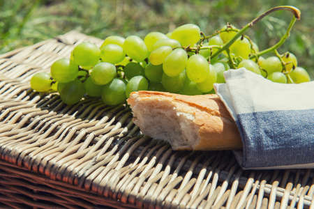 Picnic concept - wine cheeses and grapes.の写真素材