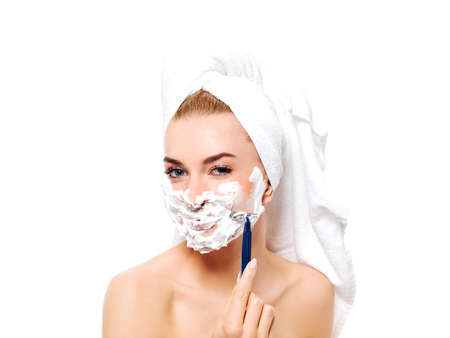 Young woman have morning shave.の写真素材