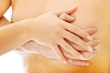 Man touching beautiful woman's breast.の写真素材