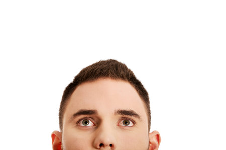 Half head of young man.