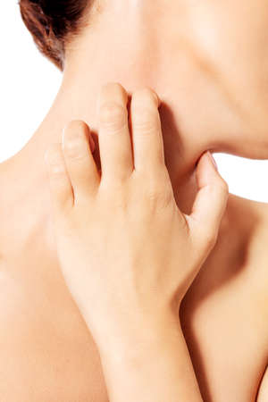 Topless woman scratching her neckの写真素材