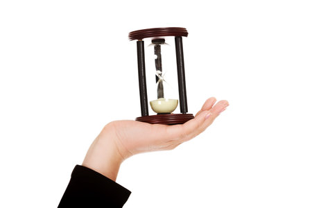 Young business woman holding hourglass-time concept.