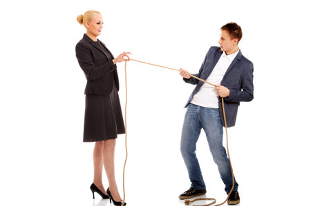 Boss concept-woman holding rope in two fingers, man pulling a rope and can't win.の写真素材