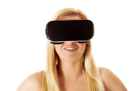 Girl wearing virtual reality goggles - isolated on white.