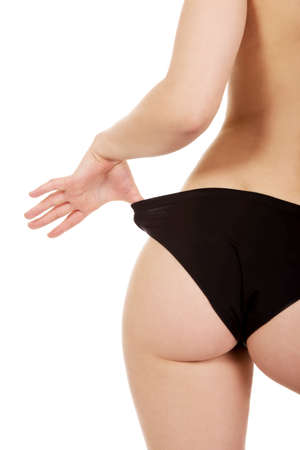 Sexy young woman back in panties.の写真素材