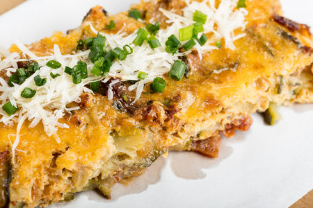 Vegetables casserole with cheese and chivesの写真素材