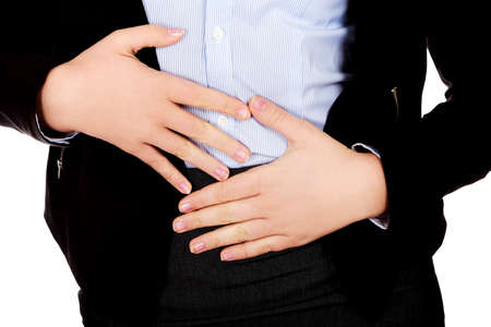 Business woman with stomach acheの写真素材