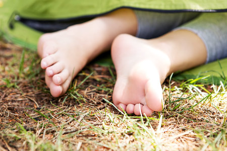 Young woman resting in a tent on the natureの写真素材