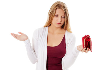 Young woman shows her empty wallet. Bankruptcyの写真素材