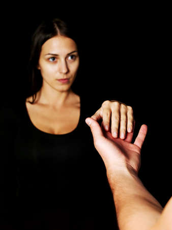 A male and a female holding hands.の写真素材