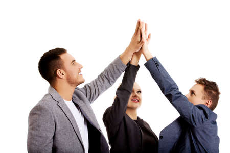 Business people giving high fiveの写真素材