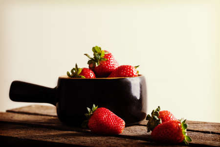 Juicy strawberry in clay vessel.の写真素材