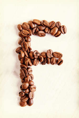 The F letter from coffee seeds.の写真素材