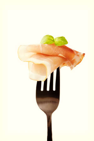 Black forest ham on fork.の写真素材