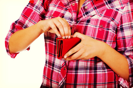 Woman holding red empty wallet.