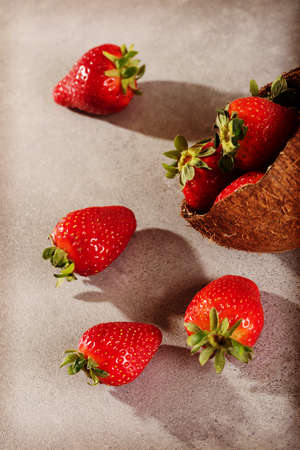 Juicy strawberry in coconut shell.の写真素材