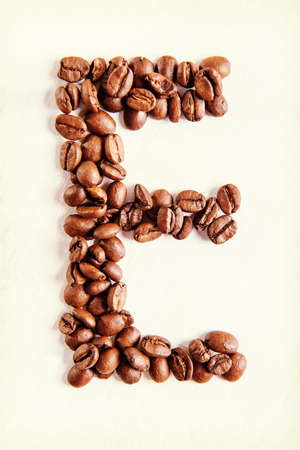 The E letter from coffee seeds.の写真素材