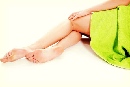 Beautiful female a feet isolated on a white background.の写真素材