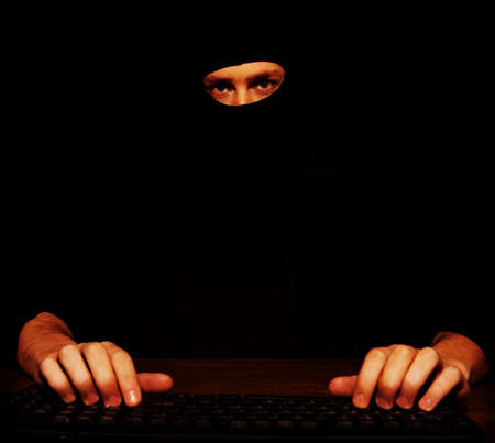 Dangerous hacker in black balaclava.の写真素材
