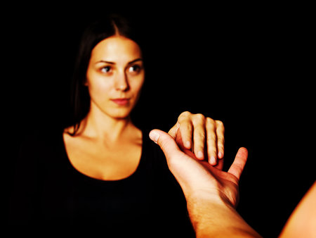 A male and a female holding handsの写真素材