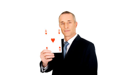 Elegant businessman with red ace card