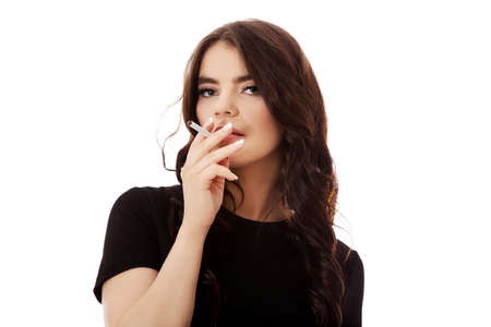 Young woman smoking cigarette.の写真素材