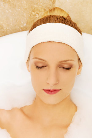 A young woman in the bath
